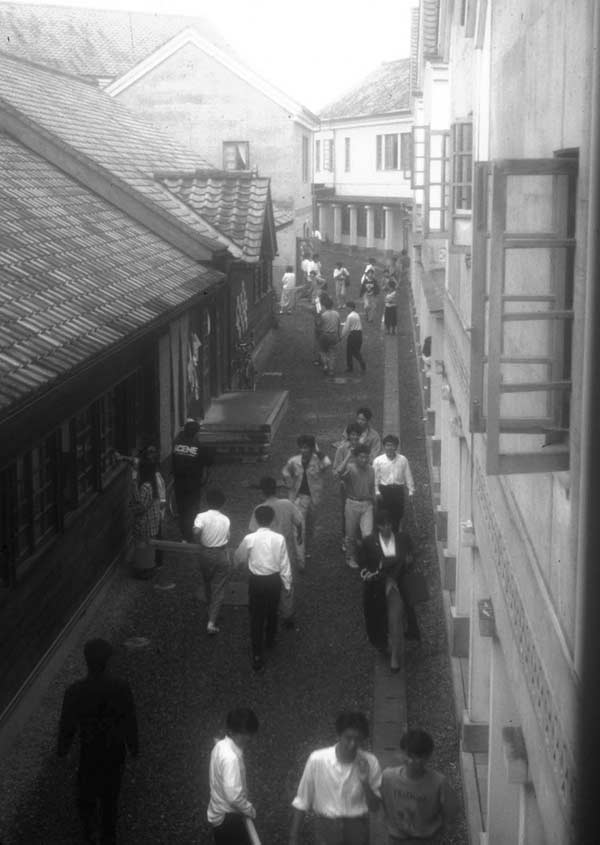 students on an internal street of the campus