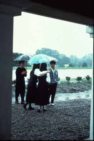 a group of students in the rain