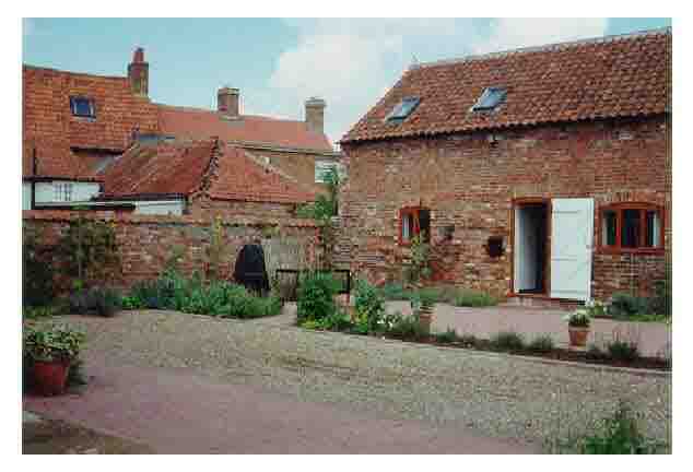 client-designed prototype low cost traditional house adapted from traditional Lincoln barn